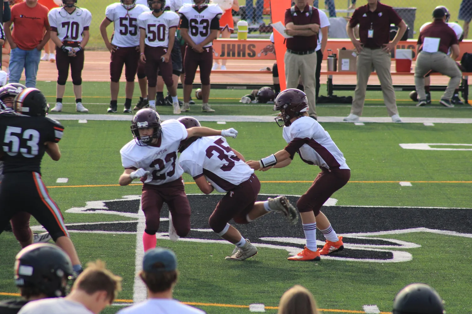 High school football players in action during a game